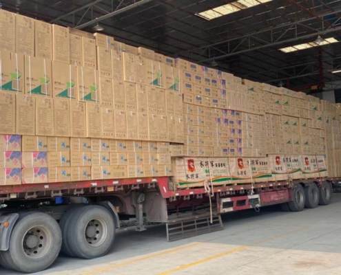 a truck load floor fans in the loading area