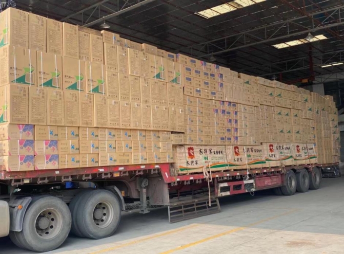 a truck load floor fans in the loading area