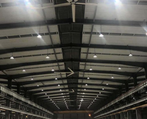 industrial ceiling fans work in a warehouse